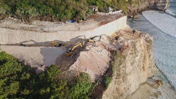 Road construction in Uluwatu, Bali. The work of escalators and the destruction of the rock video
