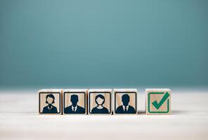 Testing, quality assessment, and selection of applicants. Wooden block with human icon with copy space. Concepts of human resource management, examination of qualifications in organizations photo