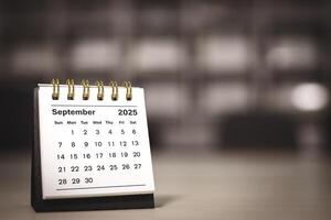 Calendar page September of the year 2025 white color in meeting room in office. with copy space and business design. concept of planning and setting new strategic goals. photo