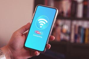A smartphone screen connected to the wireless internet. Concept of modern WiFi 7 technology that has improved efficiency, internet signal speed, and stable connection. photo