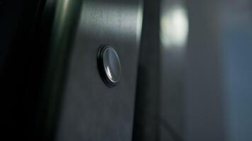 Finger Of Man Pressing Button For Call The Elevator In The Palace photo