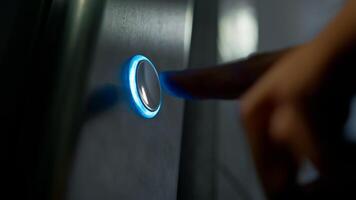 Finger Of Man Pressing Button For Call The Elevator In The Palace photo