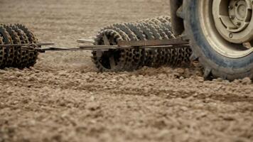 Track shoe of the excavator with soil in the background. photo