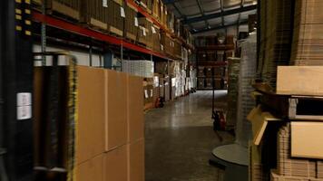 Electric forklift in warehouse loading cardboard boxes photo
