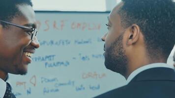 Business people diverse colleagues discussing marketing strategy presentation pitch sales manager CEO networking HR talent management graph data statistics on a whiteboard development video