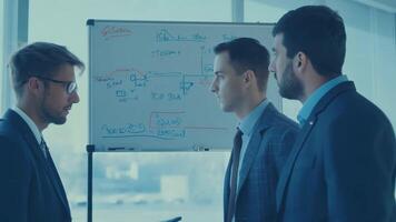 Business people diverse colleagues discussing marketing strategy presentation pitch sales manager CEO networking HR talent management graph data statistics on a whiteboard development video