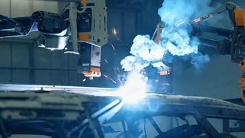 Car manufacturing production line modern assembly welding chassis automotive industry workshop line factory automobile technology research robot arm automation progress precision quality video