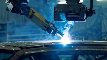 Car manufacturing production line modern assembly welding chassis automotive industry workshop line factory automobile technology research robot arm automation progress precision quality video