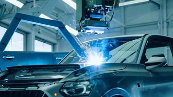 Car manufacturing production line modern assembly welding chassis automotive industry workshop line factory automobile technology research robot arm automation progress precision quality video