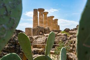Agrigento, Italy-May 10, 2022-view of the columns oh the Temple of Hercules inside the valley of the temples, an archaeological park near Agrigento during a sunny day photo