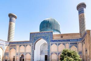 Tashkent, Uzbekistan-august 12, 2023-view of the Tamerlane Mausoleum with decorated tombs, mosaics and carvings during a sunny day photo