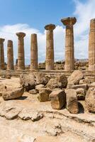 AgrigentAgrigento, Italy-May 10, 2022-view of the columns oh the Temple of Hercules inside the valley of the temples, an archaeological park near Agrigento during a sunny day photo