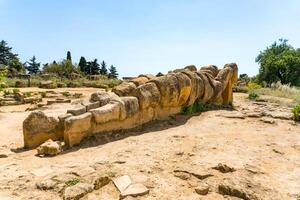 Agrigento, Italy-May 10, 2022-view of the Telamon inside the valley of the temples, an archaeological park near Agrigento during a sunny day photo
