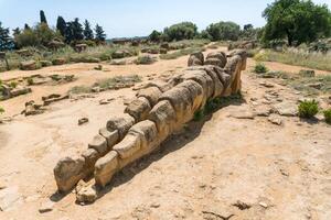 Agrigento, Italy-May 10, 2022-view of the Telamon inside the valley of the temples, an archaeological park near Agrigento during a sunny day photo