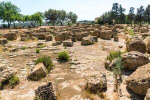 Agrigento, Italy-May 10, 2022-view of the Sanctuary of the Chthonic Divinities inside the valley of the temples, an archaeological park near Agrigento during a sunny day photo