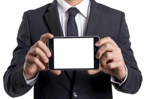 Businessman holding smart phone with blank screen. Isolated on white background. photo