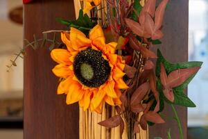 bouquet of flowers with a sunflower in the center photo