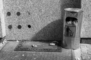 trash can with a sign on it photo