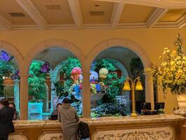 LAS VEGAS - 08.07.2024 Reception desk at the Bellagio Hotel Conservatory and Botanical Gardens. Every year the Conservatory implements five seasonal themes. photo