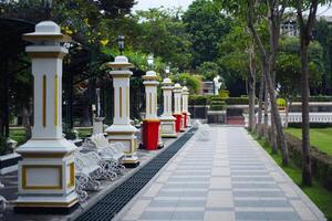 garden atmosphere with chairs and lamp pillars photo