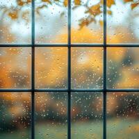 Rainy Autumn Landscape Through Wet Window Glass with Blurry Reflections photo
