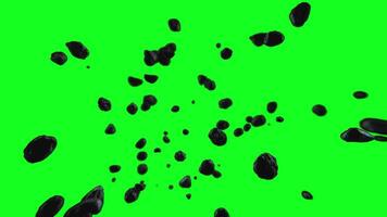 Exploding rocks moving towards the screen in slow motion with a green screen background video