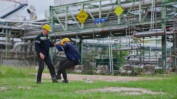 An engineer was injured in an accident while working at an oil refinery. video