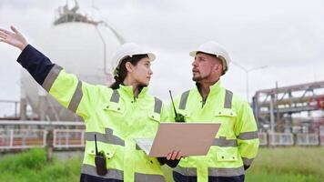 Two engineer working Industry in oil refinery equipment Check and check the condition of the machinery system , Engineering concept. video