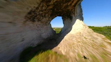 Cinematic FPV flight through a hole in the limestone rock in Poland video