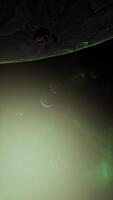 a large cluster of asteroids near an unknown planet, vertical video