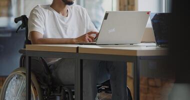 A diverse group of colleagues collaborates using laptops, mobiles, and tablets to tackle business challenges and enhance productivity through teamwork and innovative technology. video