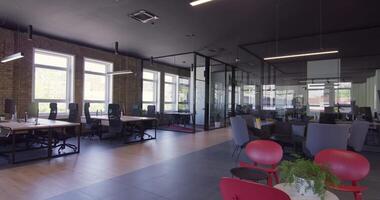 Modern startup centers composed of glass offices within a contemporary corporate environment, highlighting the sleek, innovative, and minimalist design aesthetics of a cutting-edge workspace video