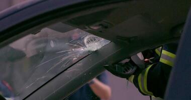 A skilled team of firefighters employs specialized tools and quick reactions to successfully extricate a person trapped in a car, showcasing their heroism and precision in a high-stakes rescue video