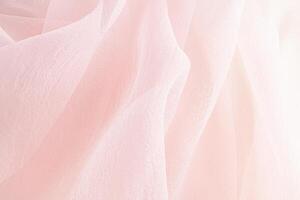 Elegant fabric background for design. Soft delicate chiffon folds of pastel-colored fabric. wedding background. Drapery of silk transparent fabric. photo