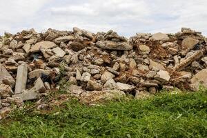 A low angle view of the many concrete ruins that have been demolished. photo