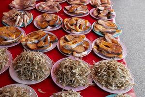 A close-up view of the background of pieces of salted fish. photo