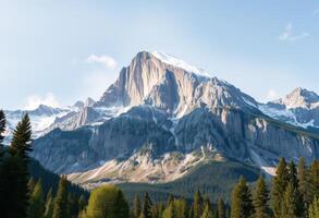 Majestic Snow-Capped Mountain Peak with Foreground Forest photo