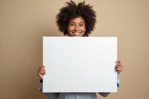 Smiling Woman Holding a Blank White Sign photo