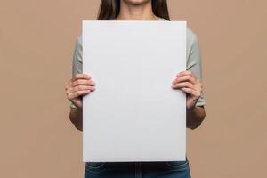 Woman Holding a Blank White Sign in Front of Her photo