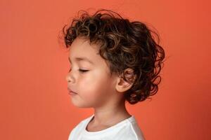 A Close-Up Profile of a Young Boy with Curly Brown Hair photo