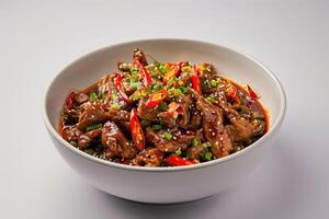 Stir-fried Meat with Chili Peppers and Sesame Seeds in a White Bowl photo