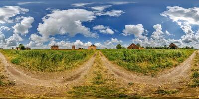 hdri 360 panorama near ruined red bricks tower and abandoned outbuildings in grass in equirectangular full seamless spherical projection with zenith and nadir, ready for VR virtual reality content photo