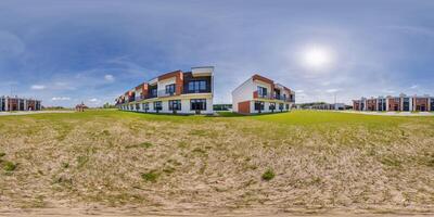 hdri 360 panorama in low-rise residential townhouse or public buildings complex with several multi-level apartments with isolated entrances in equirectangular spherical seamless projection photo