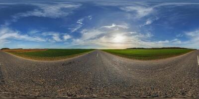spherical 360 hdri panorama on old asphalt road with cracks with clouds and sun on evening blue sky in equirectangular seamless projection, as sky replacement in drone panoramas, game development photo