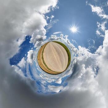 simple little tiny planet without buildings in blue sky with beautiful clouds. Transformation of spherical panorama 360 degrees. Spherical abstract aerial view. Curvature of space. photo