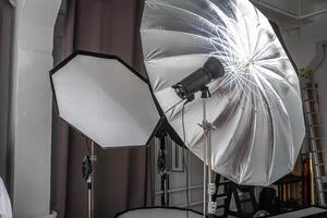 interior of bright space of photo studio with lighting equipment