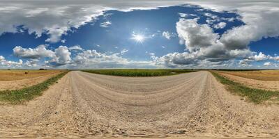 spherical 360 hdri panorama on side of gravel road with rain storm clouds in dark sky in equirectangular seamless projection, as skydome replacement in drone panoramas, game development photo