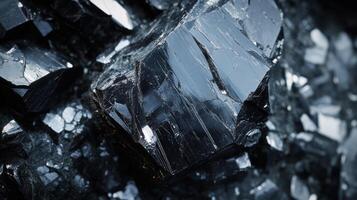 Polished tektite with a dark, glossy finish, displayed in a close-up shot that emphasizes its natural texture and reflective properties. photo