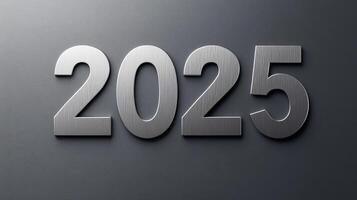 Elegant 2025 in silver serif font on a smooth gray background. photo