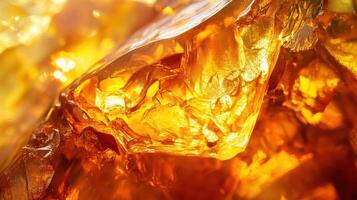 Closeup of polished amber glowing with warm golden hues photo